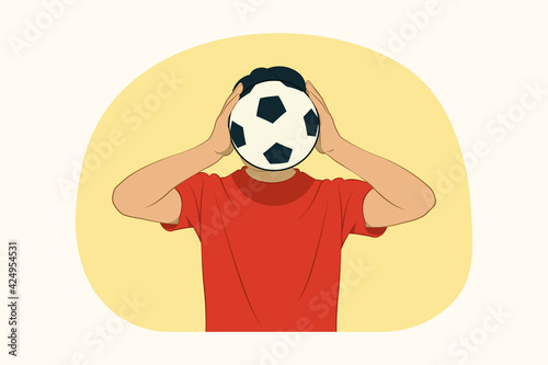Fototapeta Naklejka Na Ścianę i Meble -  Young man covering face with soccer ball concept