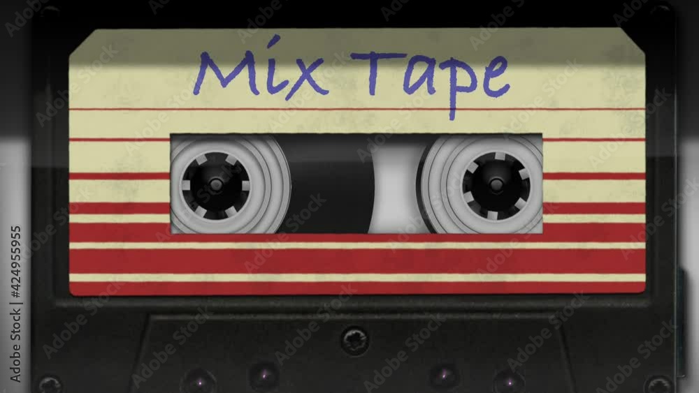Audio cassette tape in use sound recording in the tape recorder. Vintage music cassette with a blank white label, playing back in the player.