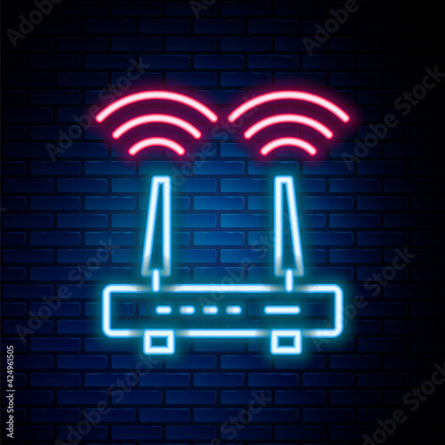 Glowing neon line Router and wi-fi signal icon isolated on brick wall background. Wireless ethernet modem router. Computer technology internet. Colorful outline concept. Vector