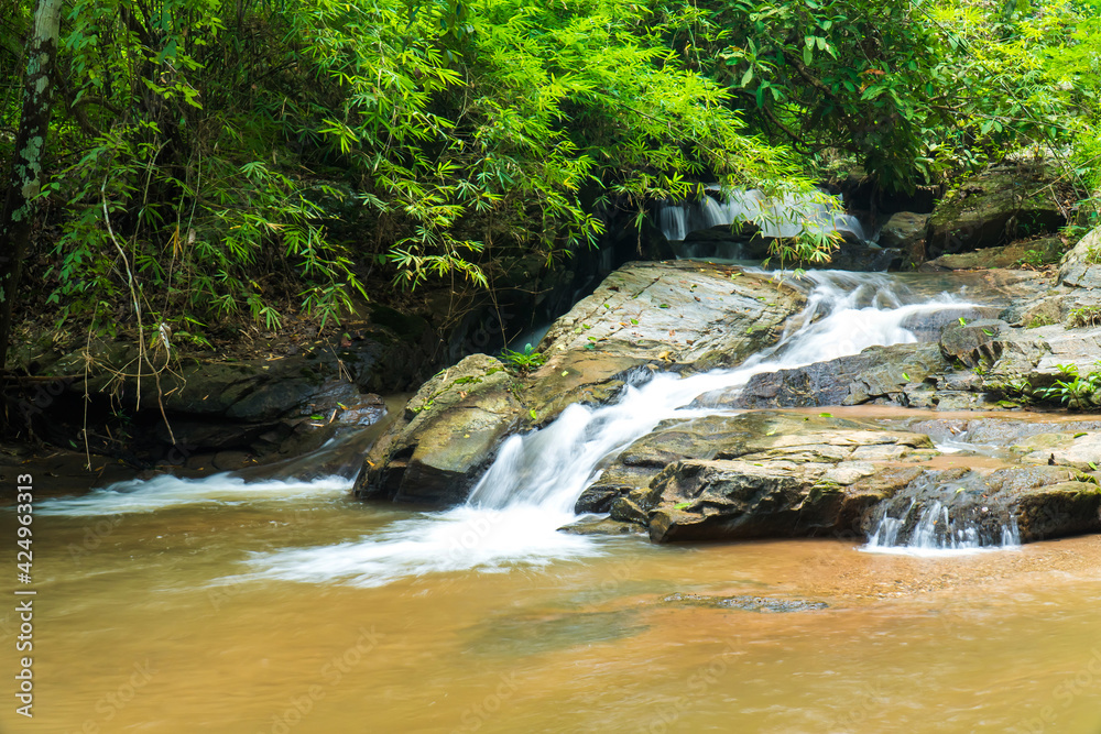 Fototapeta premium Closeup Mae Sa waterfall in Chiang Mai, Thailand. Beautiful Maesa waterfall in cool day light with green trees in Chiangmai province, Thai