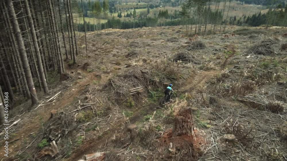 Drone Following Mountain Biker Hitting Jumps on Advanced Trail Drone Following Mountain Biker Hitting Jumps on Advanced Trail