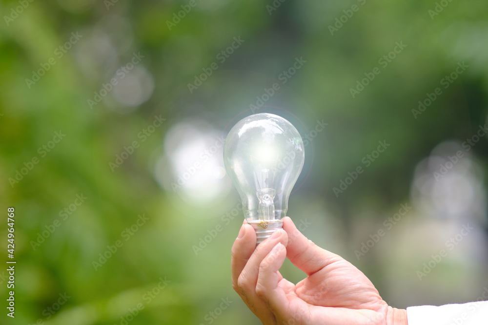 Businessman hand holding light bulb and business growth concept,Creative new idea, business plan success Businessman hand holding light bulb and business growth concept,Creative new idea, business plan success