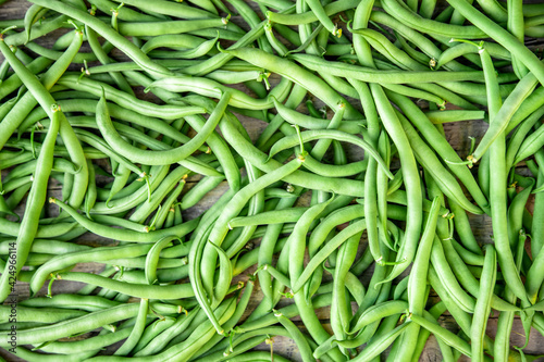 Vegetable background, fresh and raw green bush beans, Phaseolus vulgaris