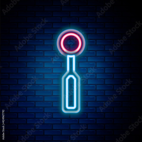Glowing neon line Dental inspection mirror icon isolated on brick wall background. Tool dental checkup. Colorful outline concept. Vector