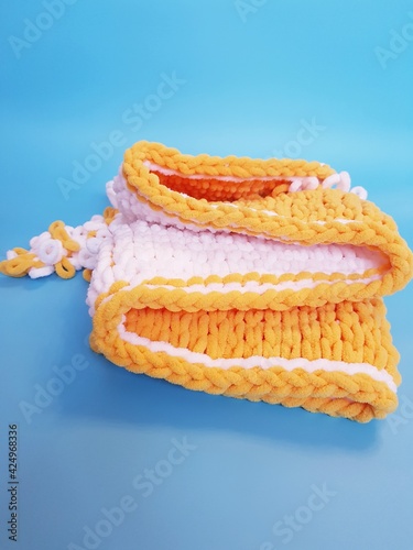 hand-knitted yellow and white plaid knitting, chunky knitting, close-up