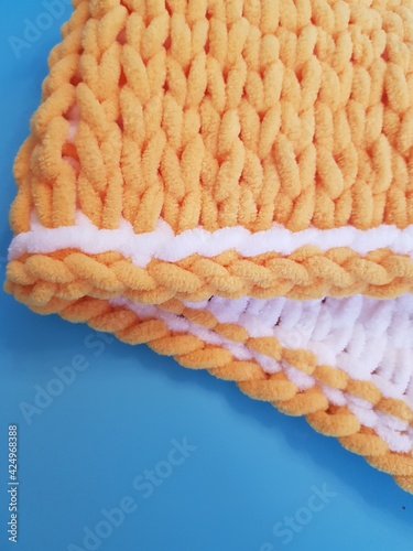 hand-knitted yellow and white plaid, chunky knitting, close-up