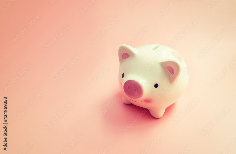 Piggy bank with copy space on pink background for Saving concepts