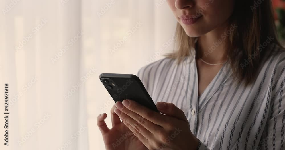 Close up woman hold smartphone choose goods on web store purchasing fashion clothes use online retail services, enjoy pleasant flirty chat in social media network. Fun, modern technology usage concept Close up woman hold smartphone choose goods on web store purchasing fashion clothes use online retail services, enjoy pleasant flirty chat in social media network. Fun, modern technology usage concept