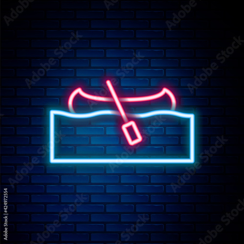 Glowing neon line Kayak and paddle icon isolated on brick wall background. Kayak and canoe for fishing and tourism. Outdoor activities. Colorful outline concept. Vector