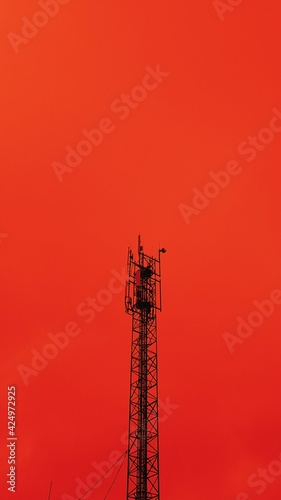 5g network antenna tower. Fast speed connection. Red toned. Bottom view