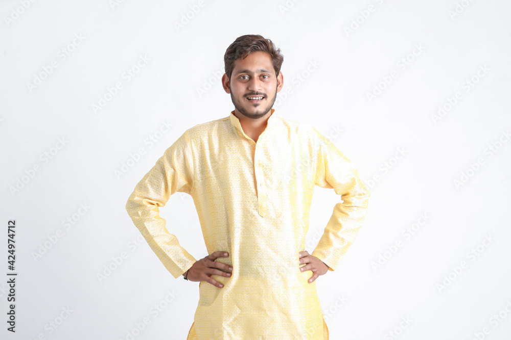 Young indian man in tradition wear and standing on white background. Young indian man in tradition wear and standing on white background.