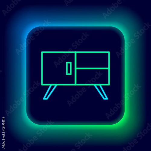 Glowing neon line Chest of drawers icon isolated on black background. Colorful outline concept. Vector