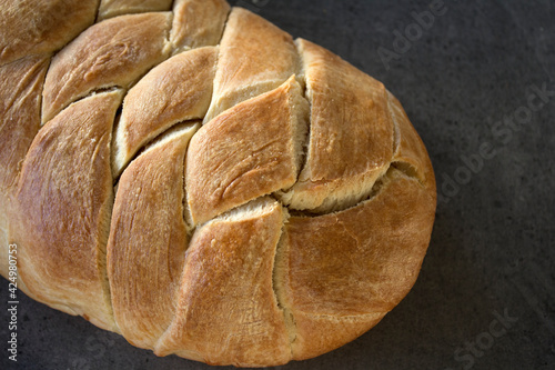 Freshly baked white bread on a table. Sourdough bread texture close up. Homemade sweet bread. 