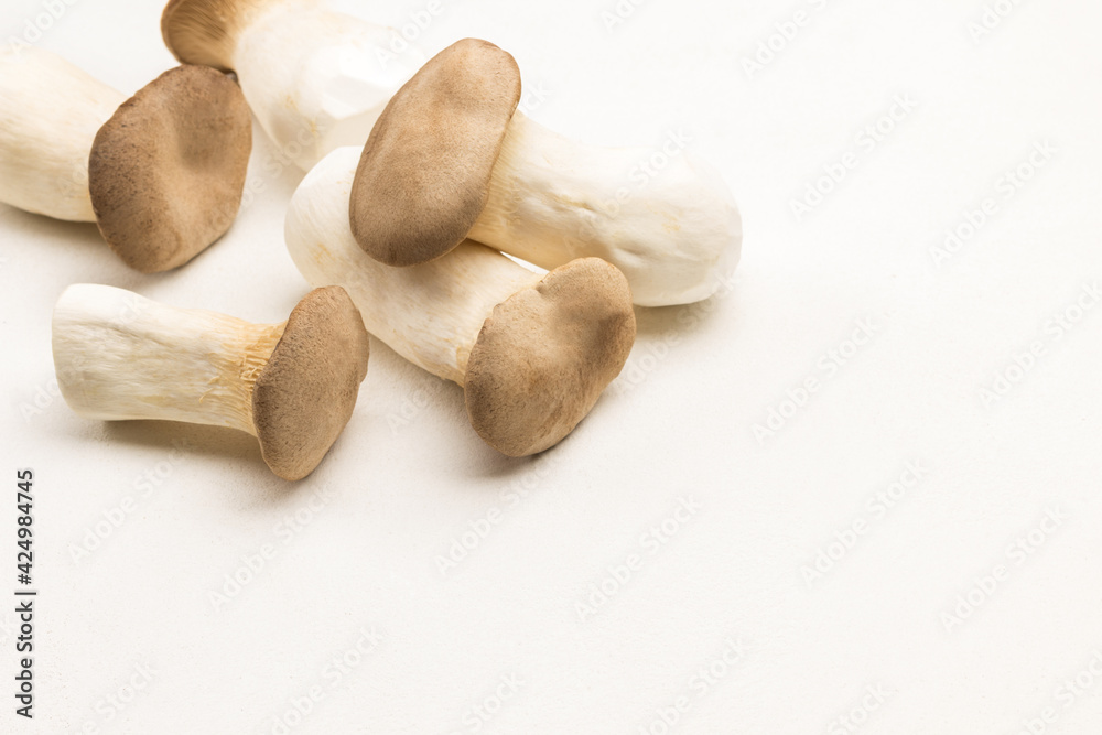 Bunch of king oyster mushrooms on table. Bunch of king oyster mushrooms on table.