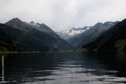 lake in snowy alps mountains