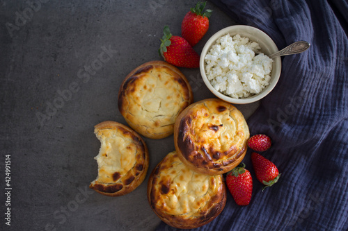 Wallpaper Mural Freshly baked patties with quark. Top view photo of sweet scones with cottage cheese on a table. Homemade pastry items. Torontodigital.ca