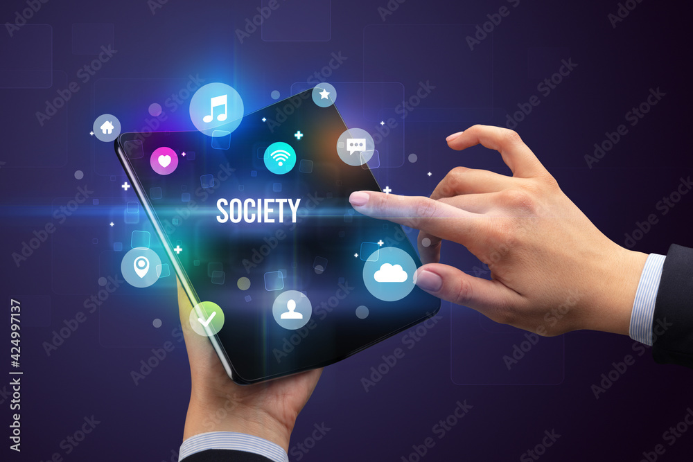 Businessman holding a foldable smartphone