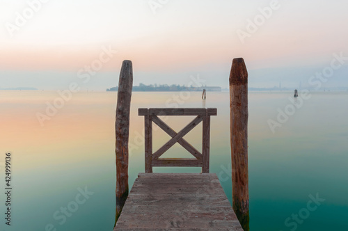 Cold winter calm on pier over Venice lagoon photo