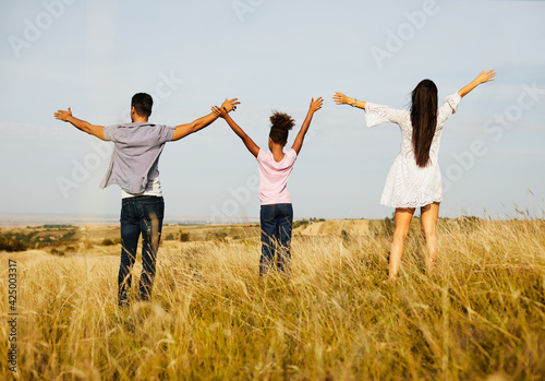 child daughter family happy mother father love hope future together girl cheerful field outdoor summer