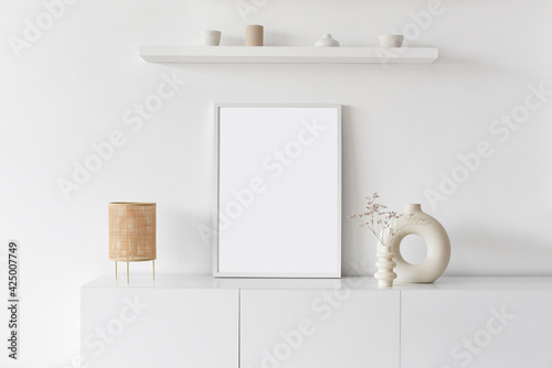Fotografija Blank picture frame mockup on white wall