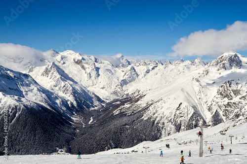 Beautiful snowy mountains and blue sky Dombay Karachay-Cherkessia
