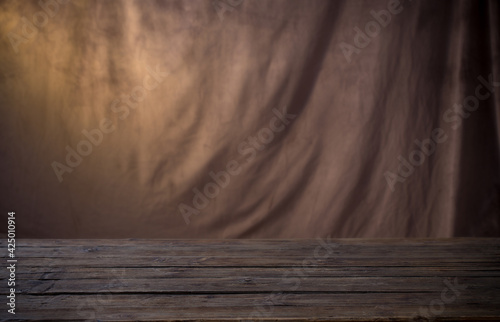 background of brown fabric and wooden table