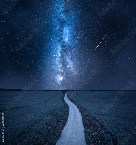 Milky way over country road in countryside. Nature in Poland