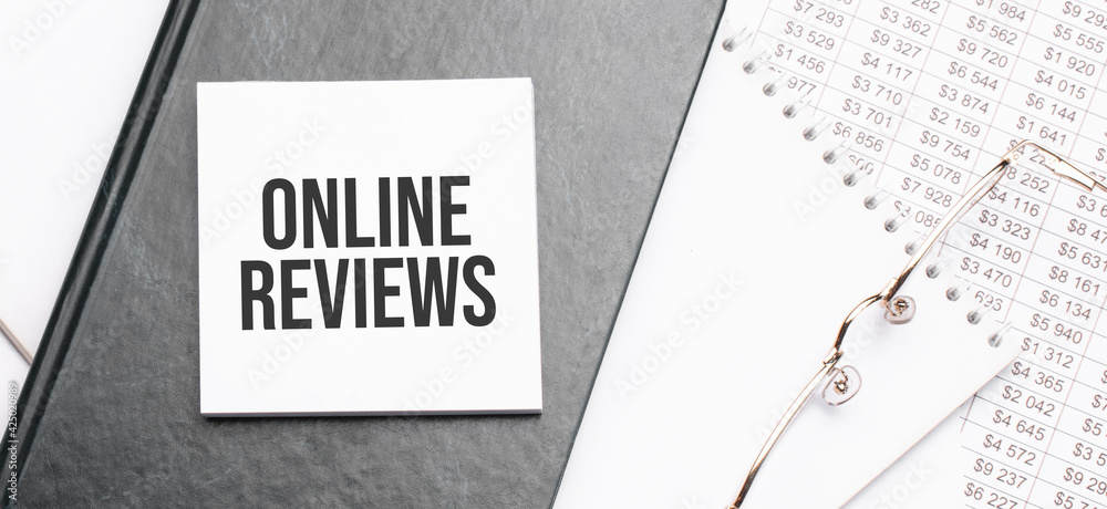 Text Online Reviews On Notepad With Office Tools Pen On Financial Report Business And Financial Conzept Calculator And The Working Paper With A Diagram Stock Photo Adobe Stock