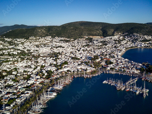 Amazing panoramic view from drone of beautiful full of yachts Bodrum harbour and ancient Kalesi castle in Mugla province in Turkey  © Aleksey