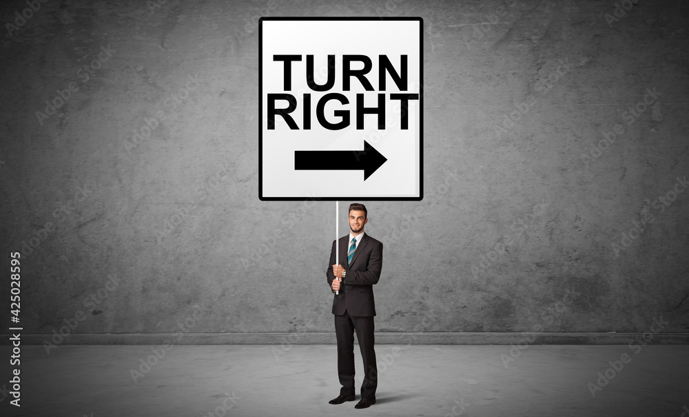 business person holding a traffic sign business person holding a traffic sign
