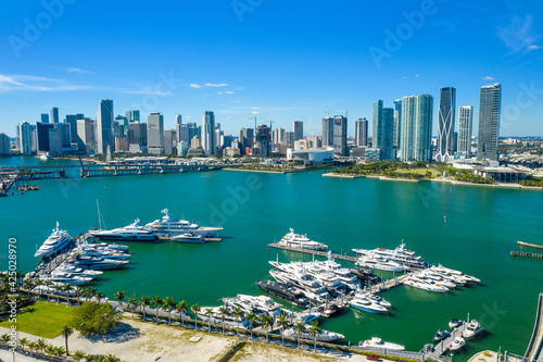 aerial drone view of boats with downtown Miami skyline in the back