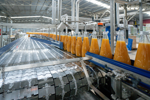 Juice factory, product line, peach juice bottle on the product line