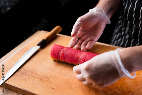 sushi with salmon and knife