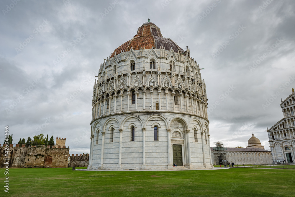 View of The Pisa Baptistery with the Cathedral in Pisa, Tuscany, Italy