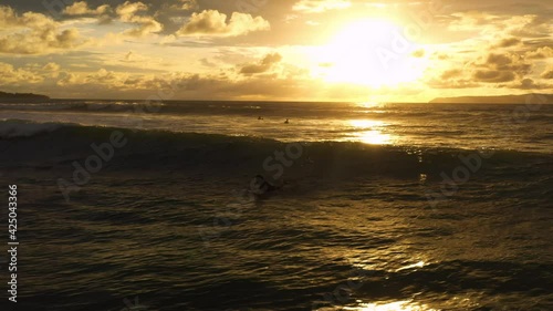 Aerial shot of a man paddling and surfing a waves Costa Rica paradise pavones photo