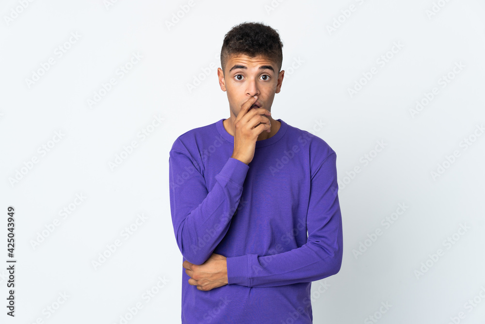 Young brazilian man isolated on white background surprised and shocked while looking right Young brazilian man isolated on white background surprised and shocked while looking right