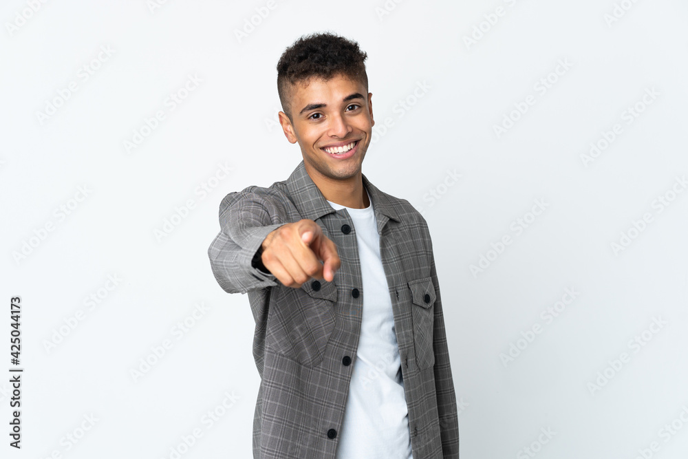 Young brazilian man isolated on white background pointing front with happy expression Young brazilian man isolated on white background pointing front with happy expression