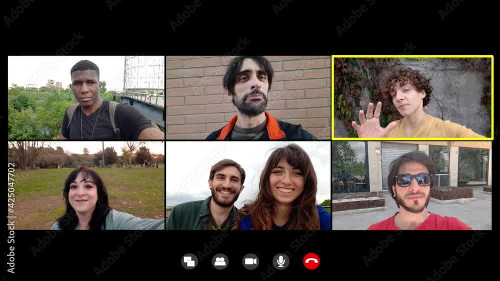 virtual meeting - young man communicates in video chat to greet his friends virtual meeting - young man communicates in video chat to greet his friends
