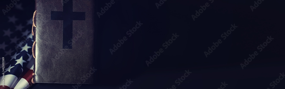 American flag and holy bible book on a mirror background. Symbol of the ...