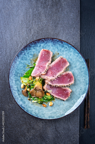 Photography Modern style traditional Japanese tuna tataki with vegetable and mushrooms serve