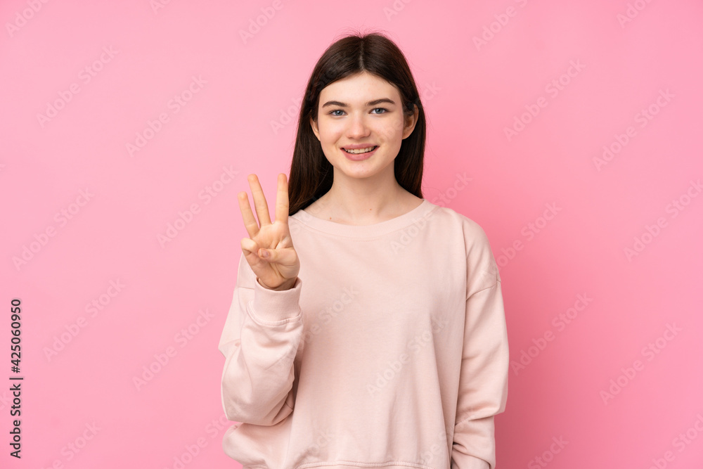 Young Ukrainian teenager girl over isolated pink background happy and counting three with fingers Young Ukrainian teenager girl over isolated pink background happy and counting three with fingers