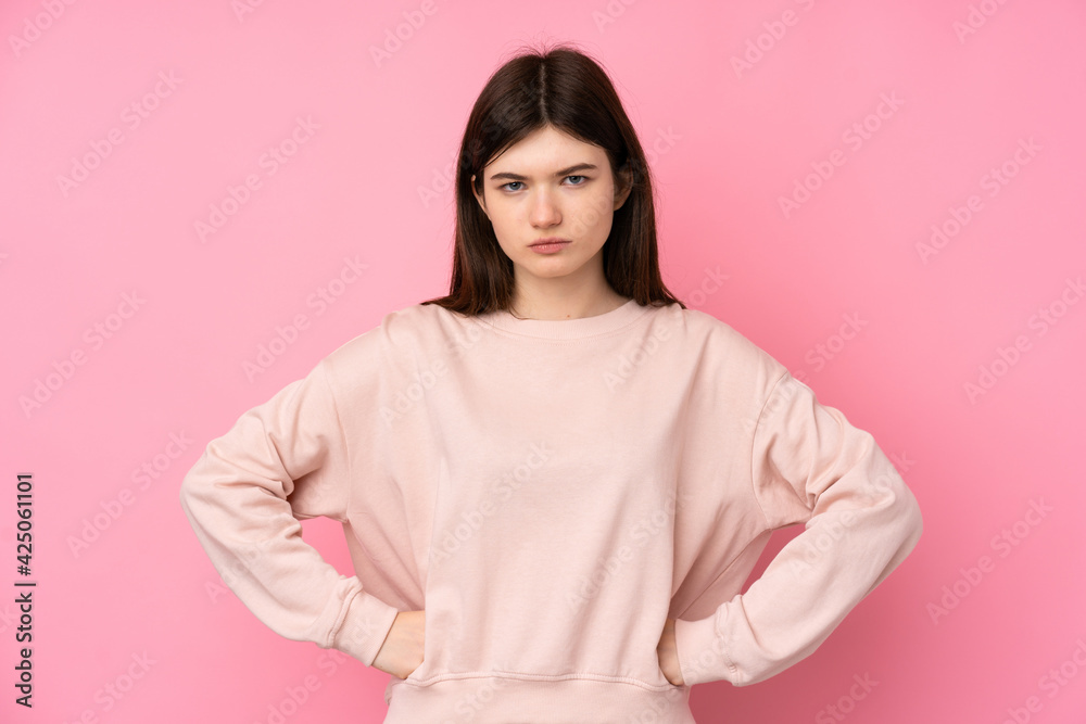 Obraz premium Young Ukrainian teenager girl over isolated pink background angry