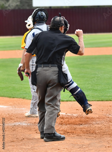 Photography Action photo of athletic high school baseball player making an amazing play duri