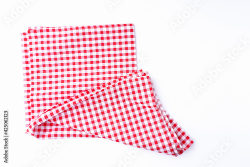 Red and white tablecloths crumpled on white the table. Cloth on white background top view and with copy space.