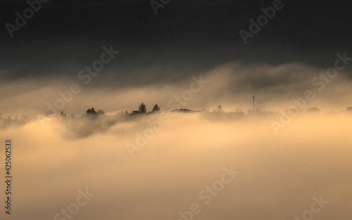 foggy sunrise view on hills