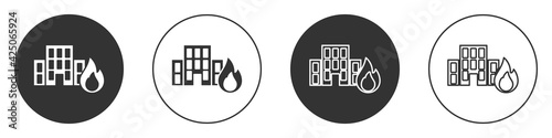 Black Fire in burning buildings on city street icon isolated on white background. Destroyed city on fire. Circle button. Vector