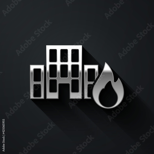 Silver Fire in burning buildings on city street icon isolated on black background. Destroyed city on fire. Long shadow style. Vector