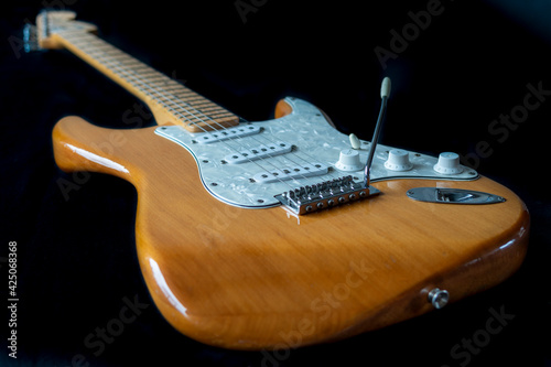 Electric guitar on black background