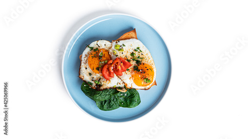 Toasts with eggs and vegetables isolated on white background.