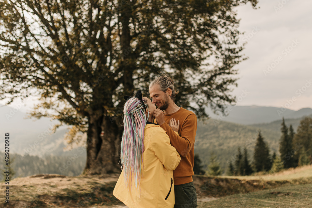 couple in love enjoying each other and walking in the mountains couple in love enjoying each other and walking in the mountains